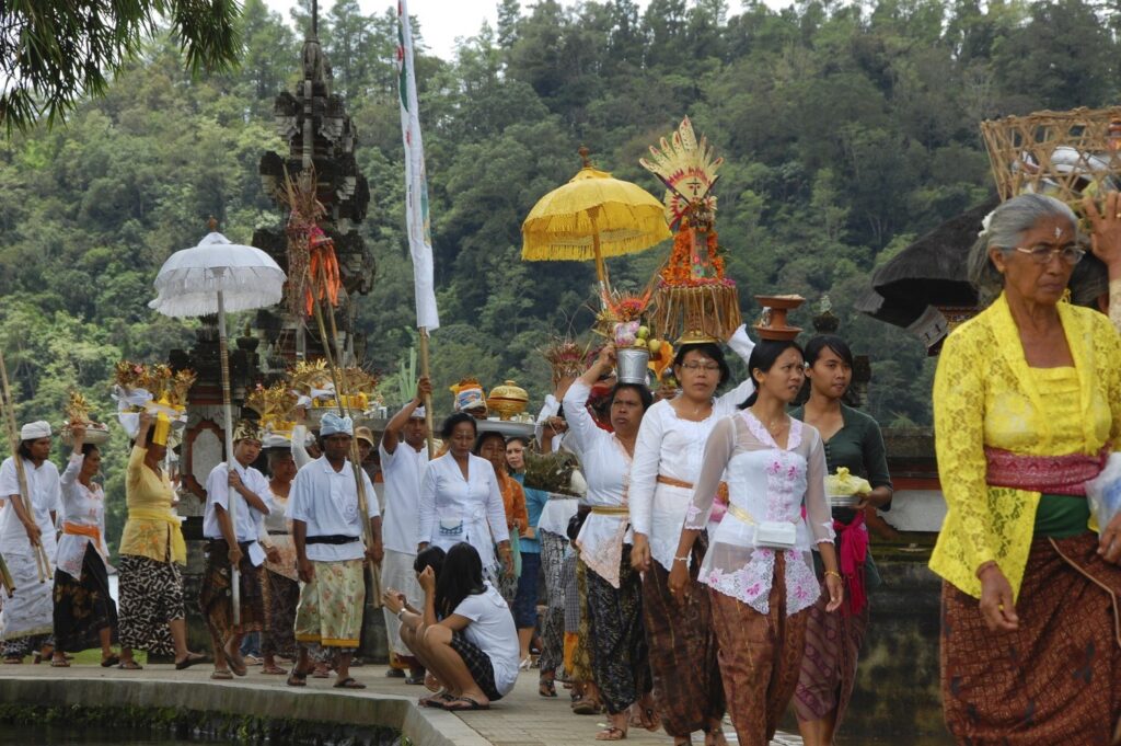 A procession with offerings entering a Hindu temple Bali