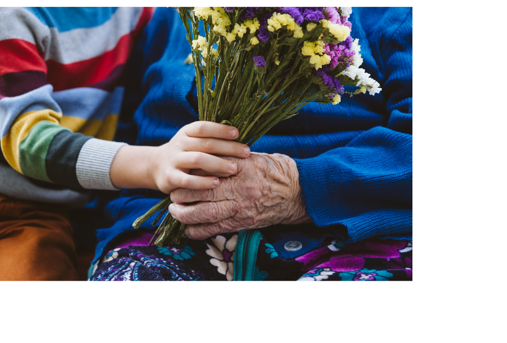 Child Giving Bouquet of Flowers to Senior Person